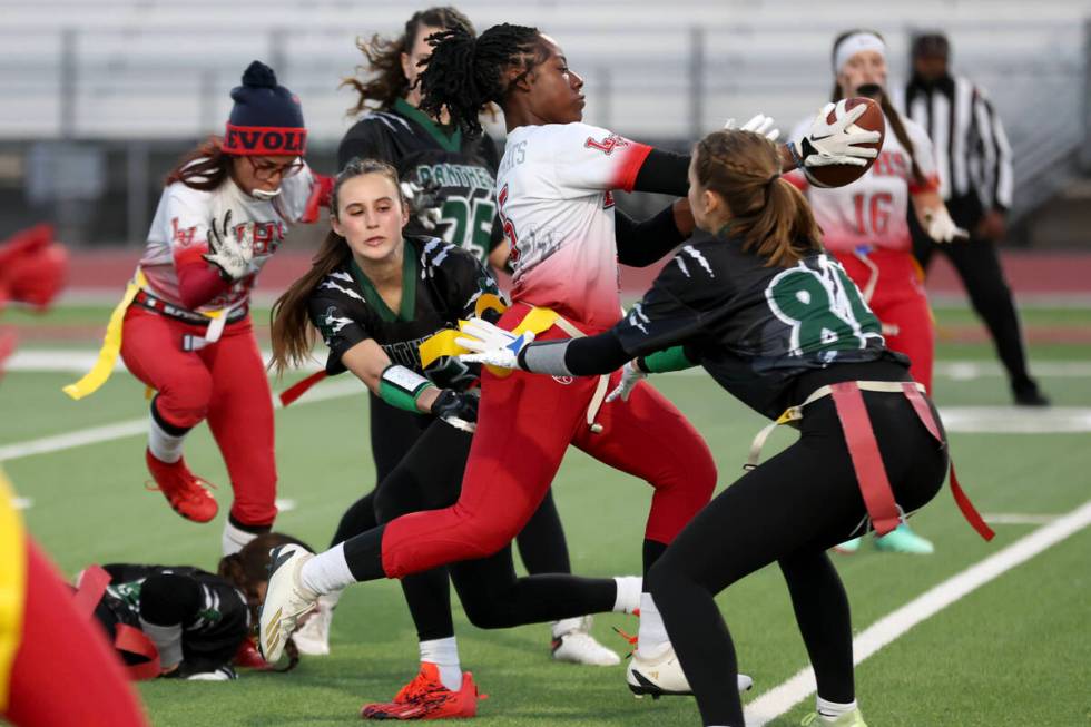 Las Vegas’ Antonia Pierce (5) runs the ball but is thwarted by Palo Verde’s Tia B ...