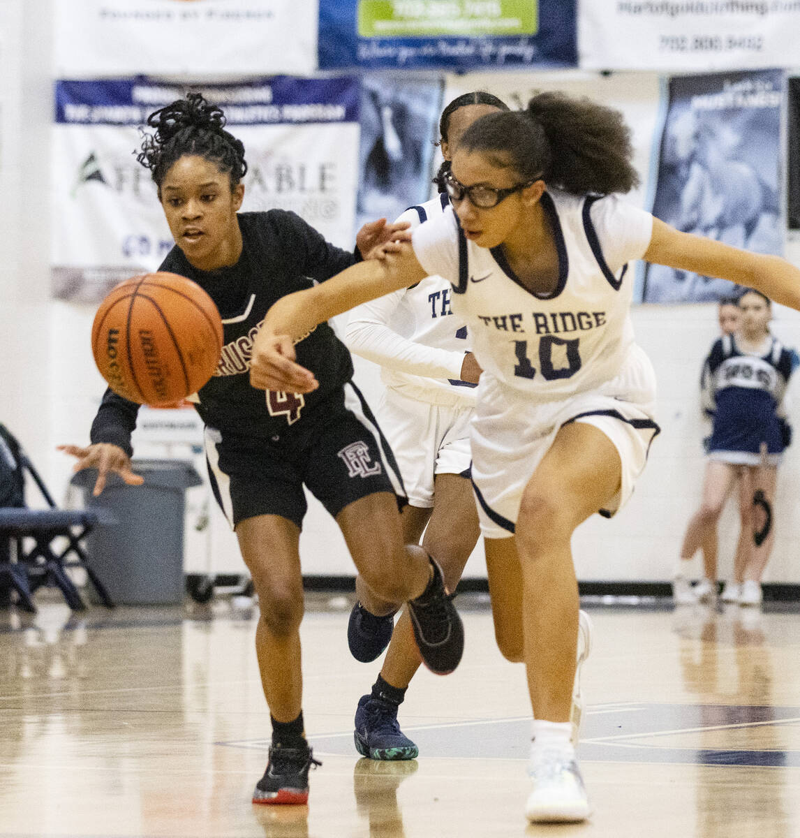 Faith Lutheran's Tamiah Harrison (4) and Shadow Ridge's Jaslyn Jefferson (10) fight for the loo ...