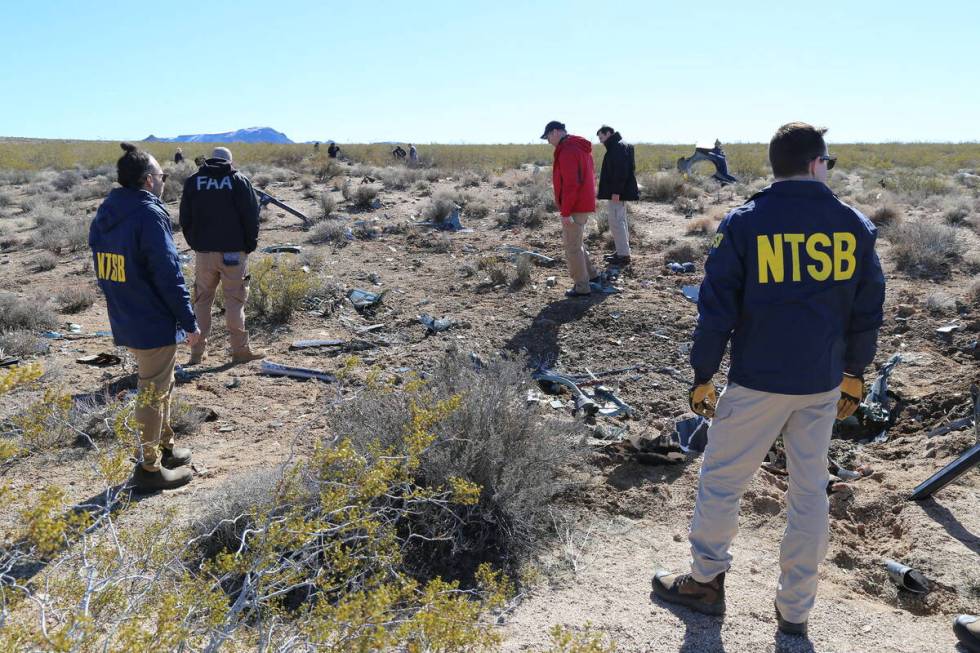 NTSB investigators at the site of the Feb. 9, 2024, crash of an Airbus Helicopters EC-130 near ...