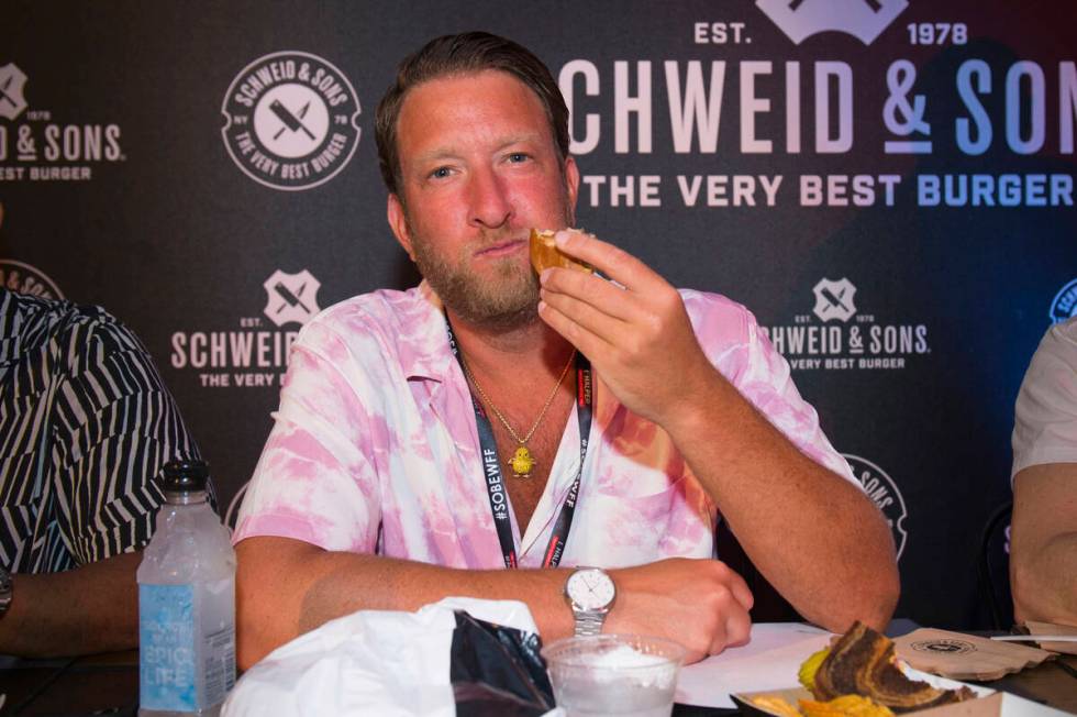 Dave Portnoy eats a hamburger at Burger Bash during the South Beach Wine and Food Festival on F ...