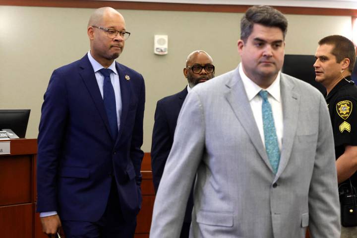 Nevada's Attorney General Aaron Ford, left, and Matthew Rashbrook, a special prosecutor, enter ...