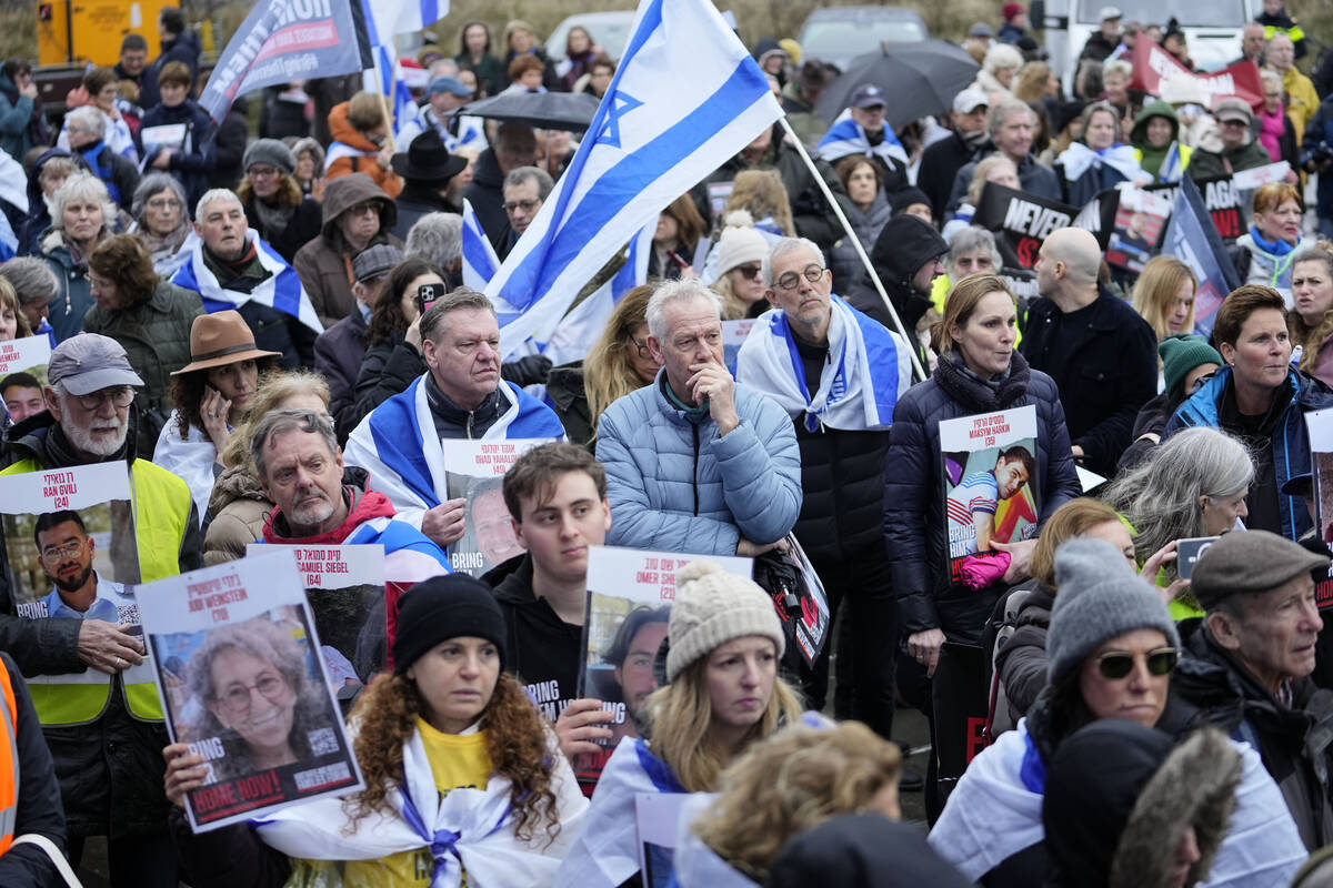 People attend a protest with families of hostages and former hostages from the Oct. 7 cross-bor ...