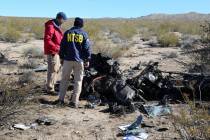 NTSB investigators survey the site of an Airbus Helicopters EC-130 on Sunday, Feb. 11, 2024, ne ...