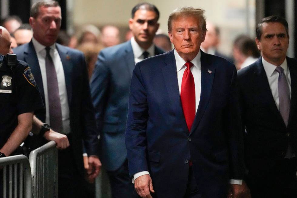 Former President Donald Trump arrives at Manhattan criminal court, Thursday, Feb. 15, 2024, in ...