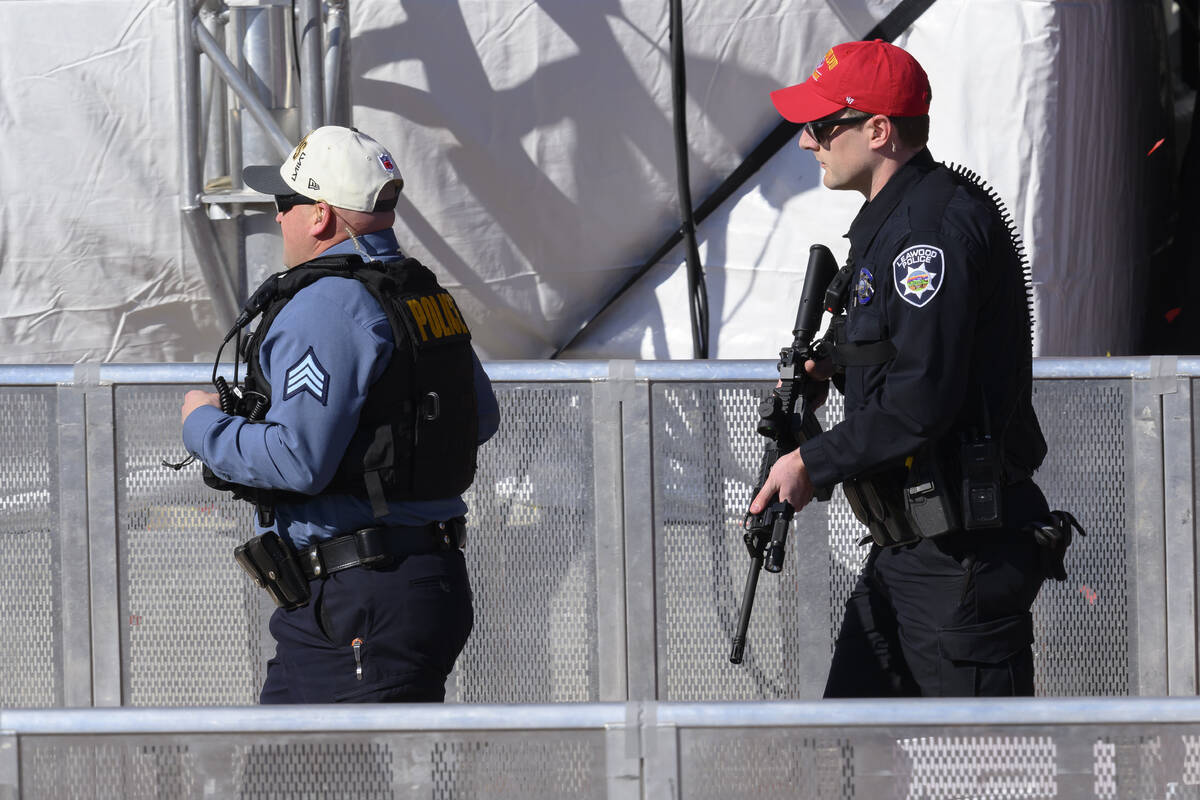 Law enforcement personnel arrive to investigate following a shooting at the Kansas City Chiefs ...
