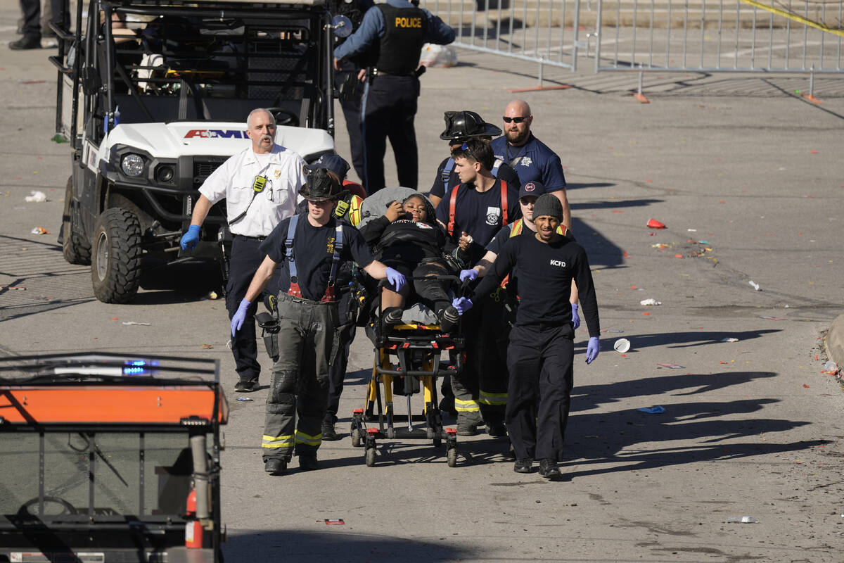 A person is taken to an ambulance after an incident following the Kansas City Chiefs victory pa ...