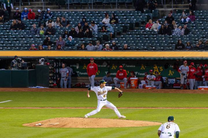 The Oakland Athletics starting pitcher Drew Rucinski delivers against the Cincinnati Reds, on F ...