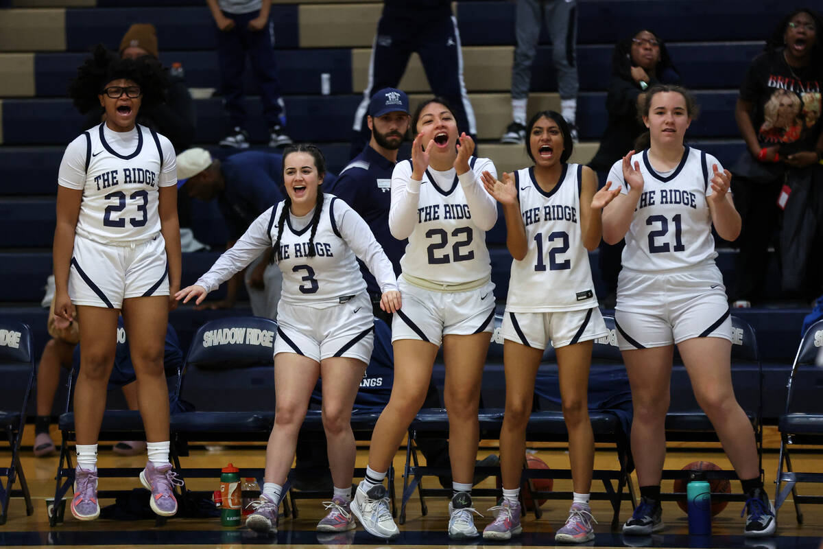 Shadow Ridge goes wild for their team during the second half of a Class 5A girls basketball sta ...