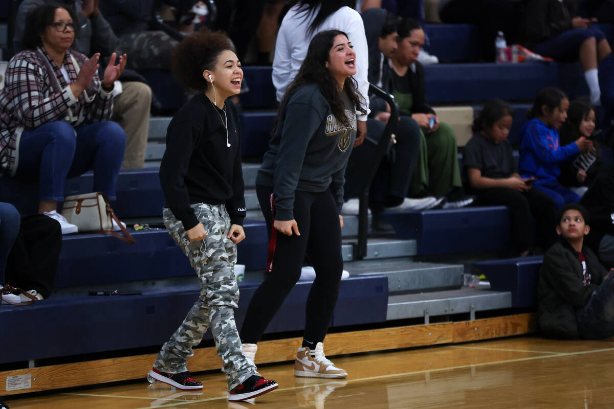 Shadow Ridge fans cheer for their team during the second half of a Class 5A girls basketball st ...