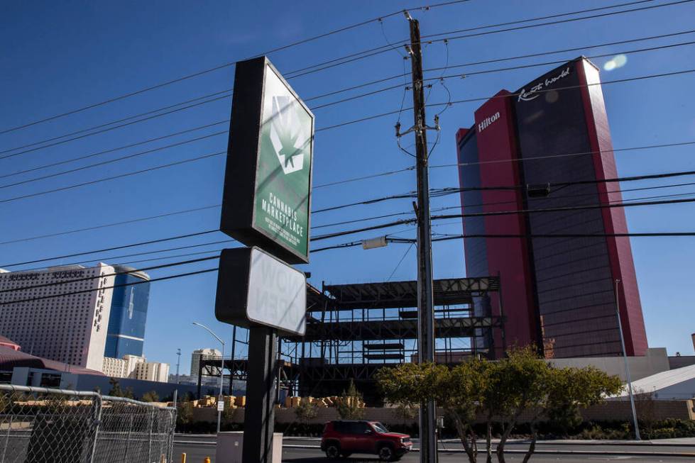 A sign advertises Thrive Cannabis Marketplace, a marijuana dispensary, at 2975 Sammy Davis Jr. ...