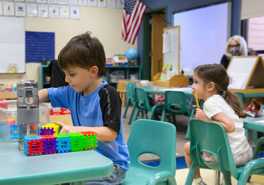 Marcus Jimmerson, center, 5, plays with building blocks at Camp Mustang at The Meadows School o ...