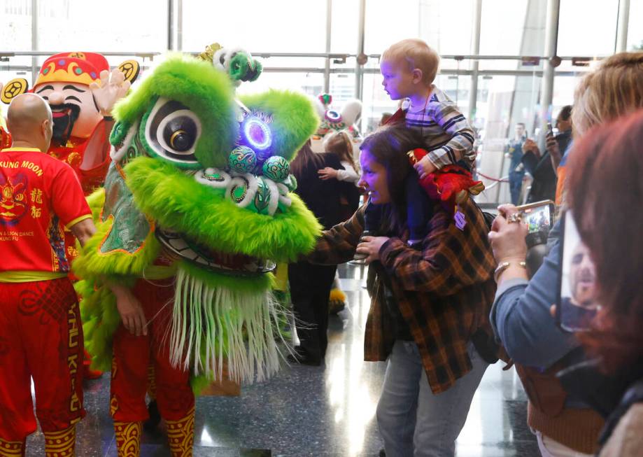 Members of Yau Kung Moon perform the Chinese Dragon and Lion dance to commemorate Lunar New Yea ...