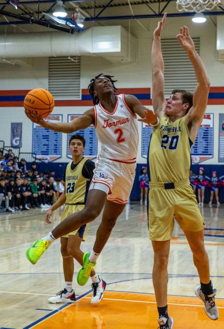 Bishop Gorman's Jett Washington (2) elevates to the basket for a shot over Foothill's Brock Ste ...