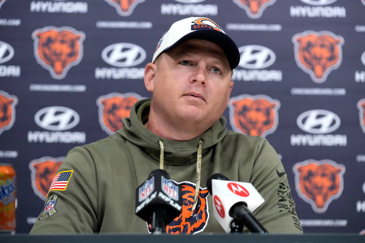 FILE - Chicago Bears offensive coordinator Luke Getsy listens to a question from the media at a ...