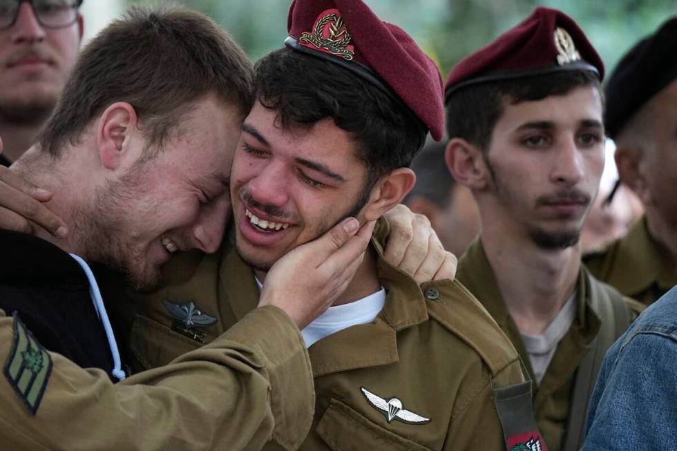 Mourners weep for Israeli Defense Forces Sgt. Rotem Sahar Hadar, a Paratrooper who was killed i ...