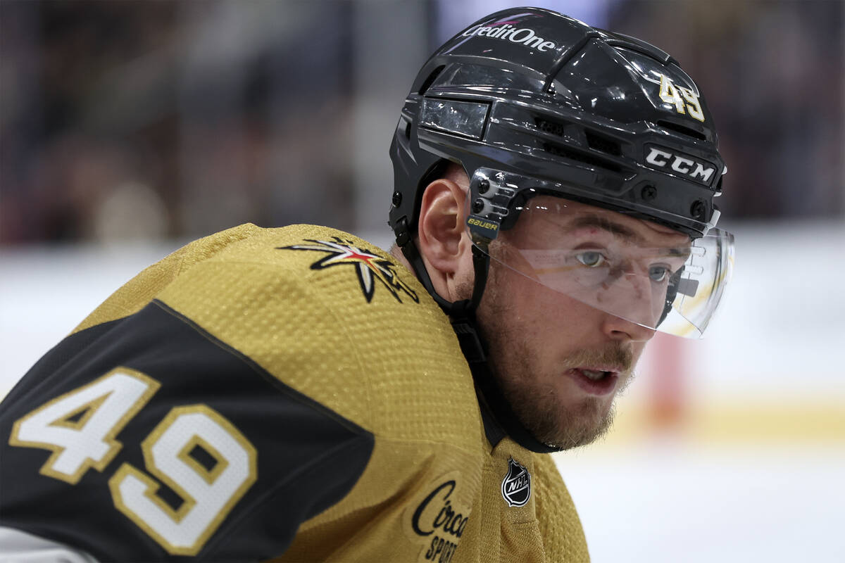 Golden Knights center Ivan Barbashev (49) eyes the puck while facing off with the Hurricanes du ...