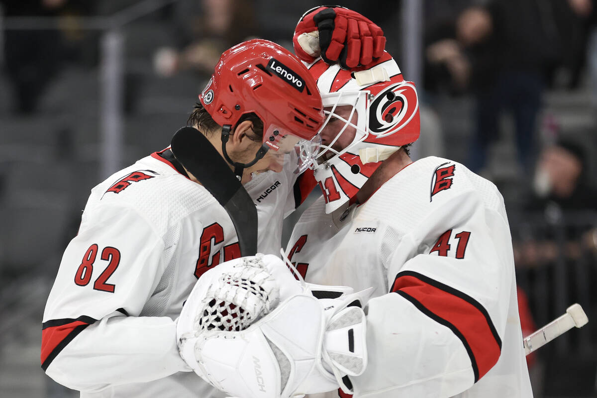 Hurricanes center Jesperi Kotkaniemi (82) and Hurricanes goaltender Spencer Martin (41) celebra ...