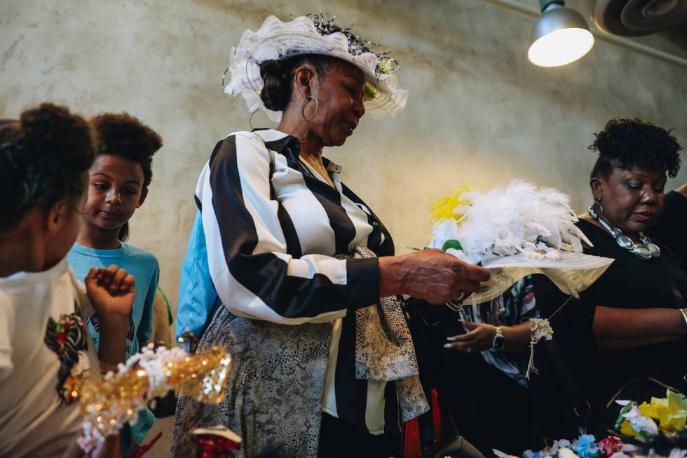 Attendees make hats at a craft table at the Springs Preserve’s 15th annual Black History ...