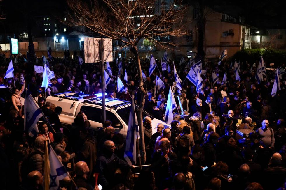 Demonstrators protest against Israeli Prime Minister Benjamin Netanyahu and call for new electi ...