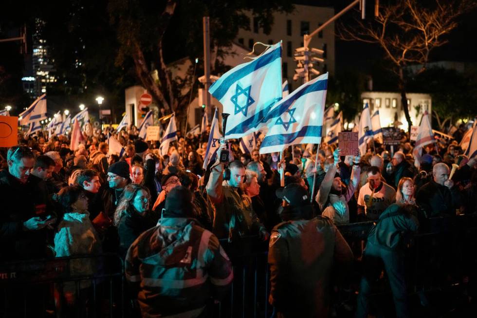 Demonstrators protest against Israeli Prime Minister Benjamin Netanyahu and call for new electi ...