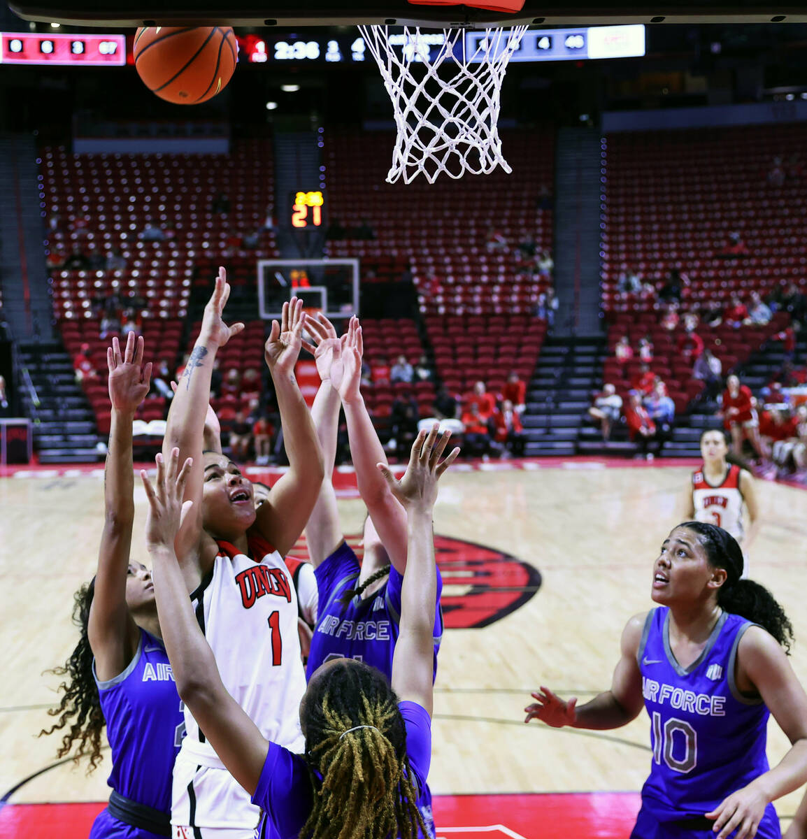 UNLV Lady Rebels forward Nneka Obiazor (1) gets offa shot in traffic facing Air Force Falcons g ...