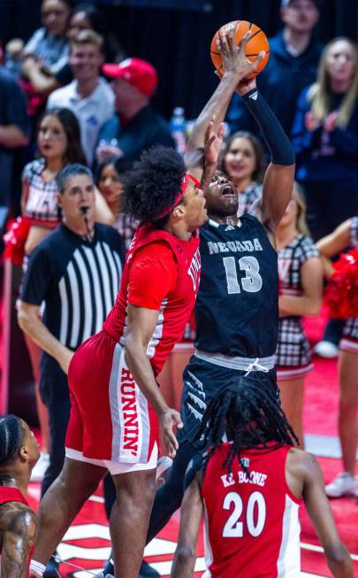 UNLV Rebels forward Rob Whaley Jr. (5) rejects a shot by UNR guard Kenan Blackshear (13) during ...