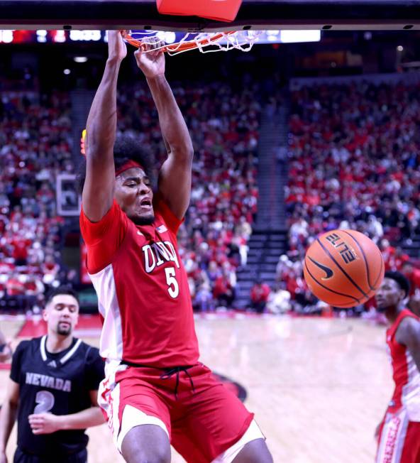 UNLV Rebels forward Rob Whaley Jr. (5) dunks the ball on UNR during the first half of their NCA ...