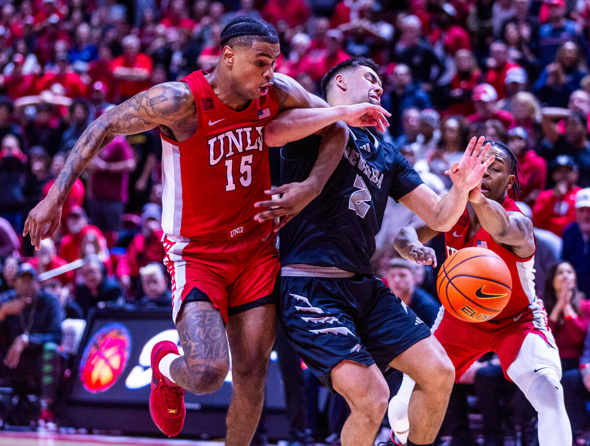 UNLV Rebels guard Luis Rodriguez (15) fouls UNR guard Jarod Lucas (2) sending him to the line l ...