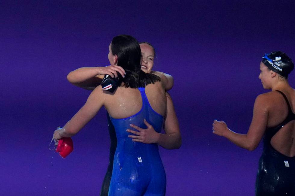 Gold medalist Freya Constance Colbert of Great Britain, left, hugs silver medalist Anastasia Go ...