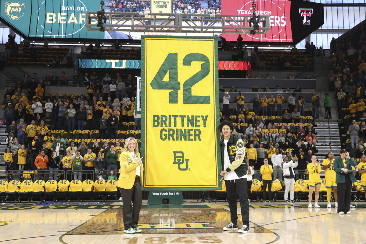 Former Baylor University legend and WNBA star Brittney Griner, right, looks on with Baylor head ...