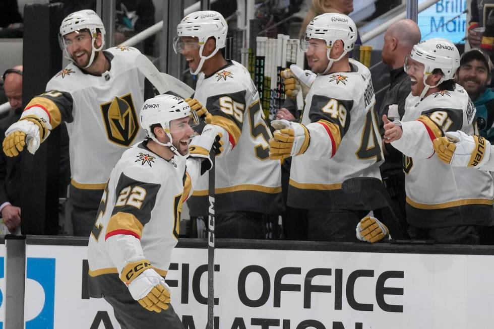 Vegas Golden Knights right wing Michael Amadio (22) is congratulated by teammates after scoring ...