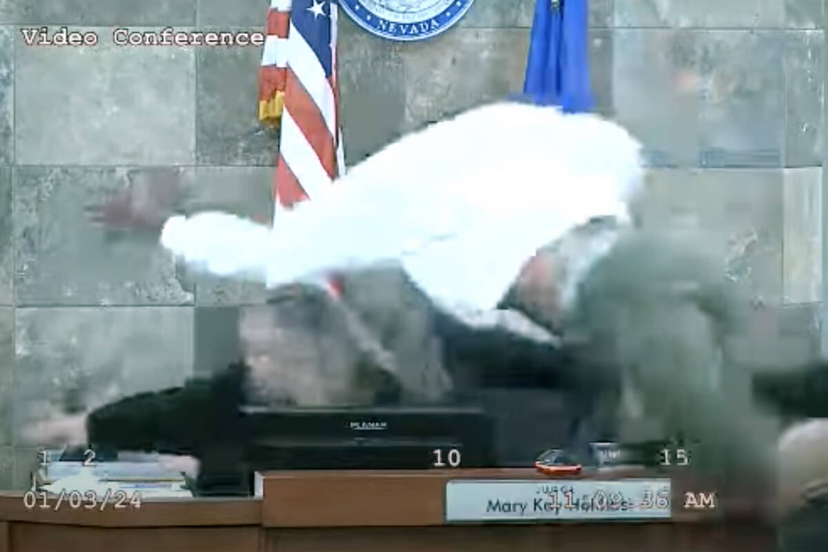 This screen shot from video shows defendant Deobra Redden attacking Judge Mary Kay Holthus afte ...
