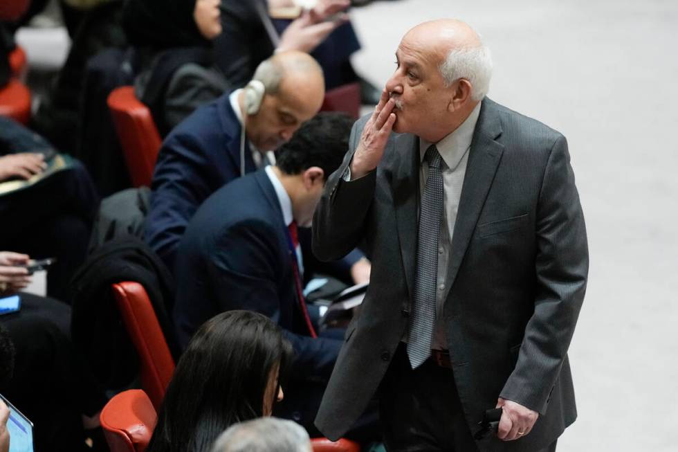 Riyad Mansour, Palestinian Ambassador to the United Nations, blows a kiss to someone before the ...