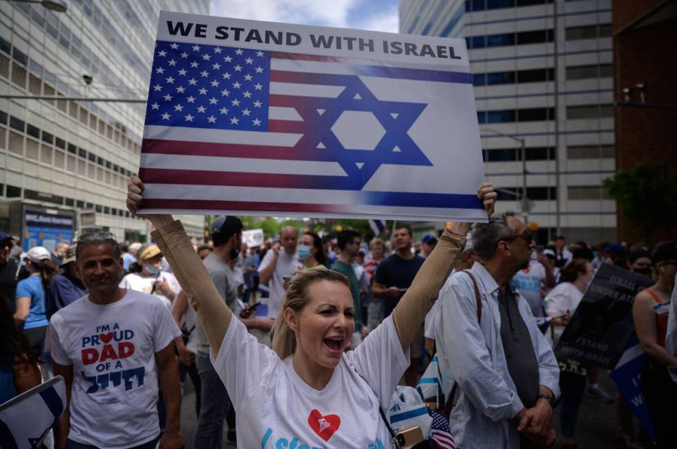 Pro-Israel demonstrators attend a rally denouncing antisemitism and antisemitic attacks, in low ...