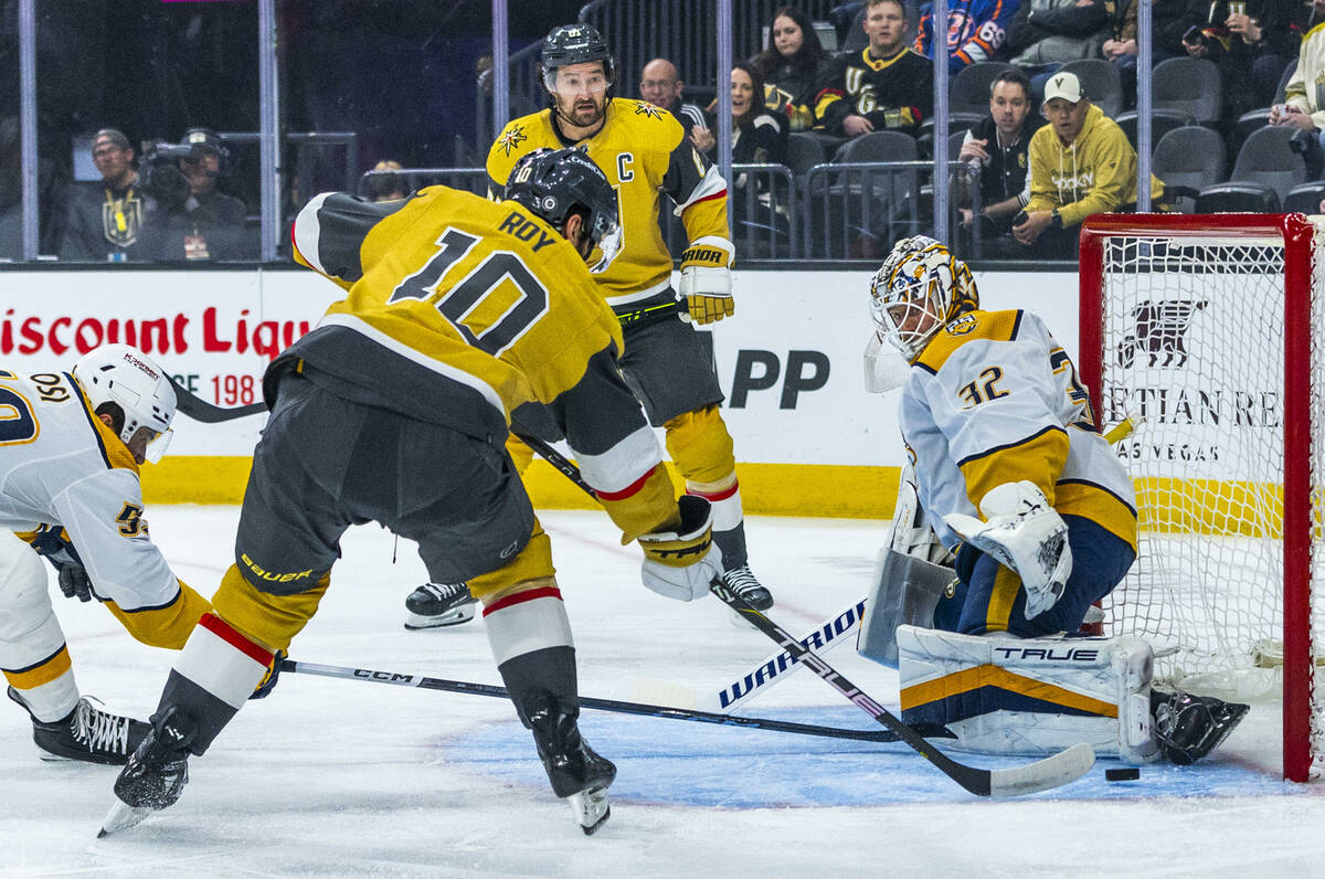 Golden Knights center Nicolas Roy (10) eyes the net as Nashville Predators goaltender Kevin Lan ...