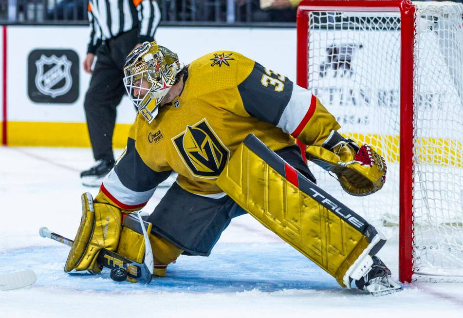 Golden Knights goaltender Adin Hill (33) stops a shot by the Nashville Predators during the sec ...