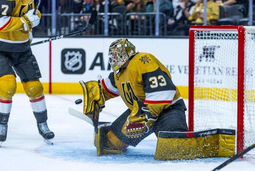 Golden Knights goaltender Adin Hill (33) stops a shot by the Nashville Predators during the sec ...