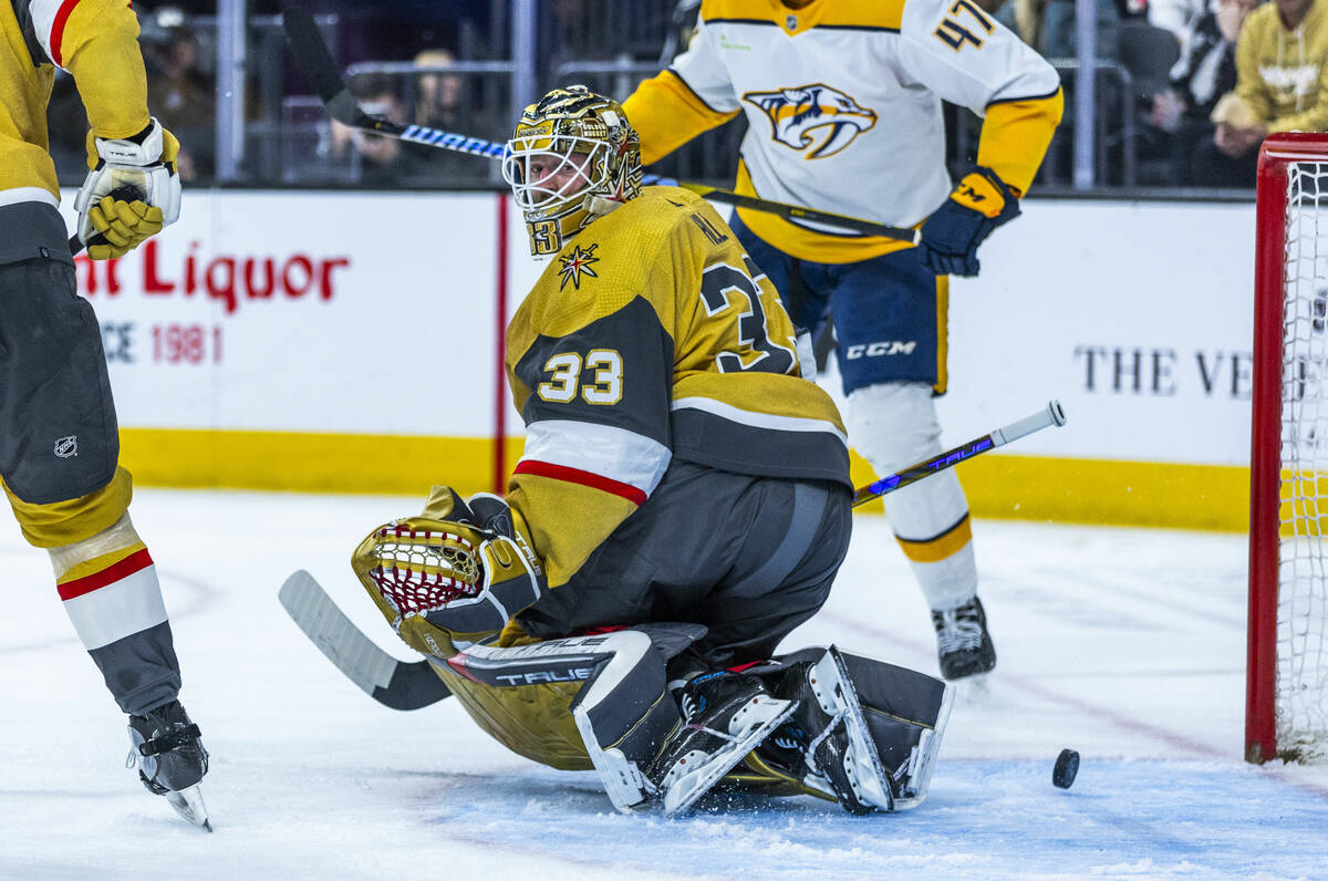 Golden Knights goaltender Adin Hill (33) watches a shot get past by the Nashville Predators dur ...