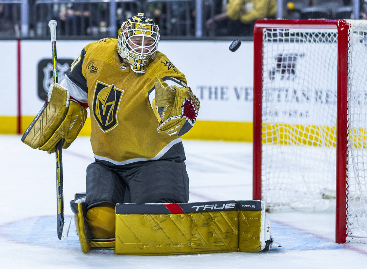 Golden Knights goaltender Adin Hill (33) watches a shot go wide by the Nashville Predators duri ...