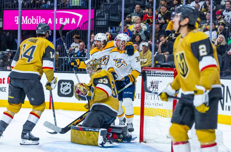 Golden Knights goaltender Adin Hill (33) has a shot get past by as the Nashville Predators left ...