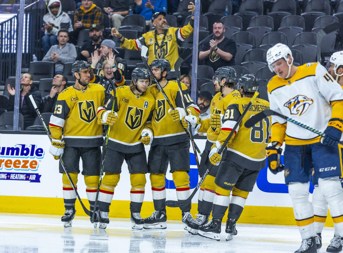 Golden Knights center William Karlsson (71) and teammates celebrate his goal against the Nashvi ...