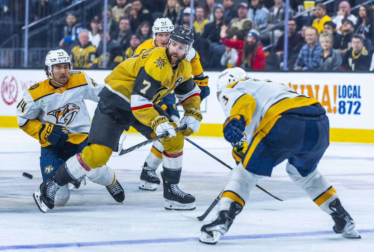 Golden Knights defenseman Alex Pietrangelo (7) looks to the puck in traffic while facing Nashvi ...