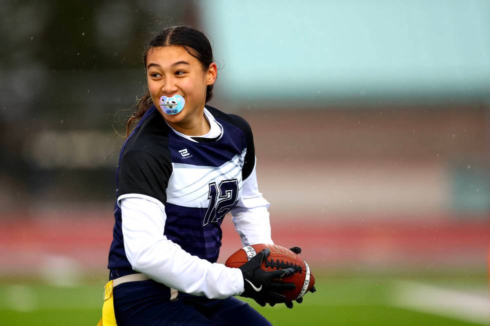 Shadow Ridge's Jaylani Palmer (12) celebrates as she scores a touchdown during the first half o ...