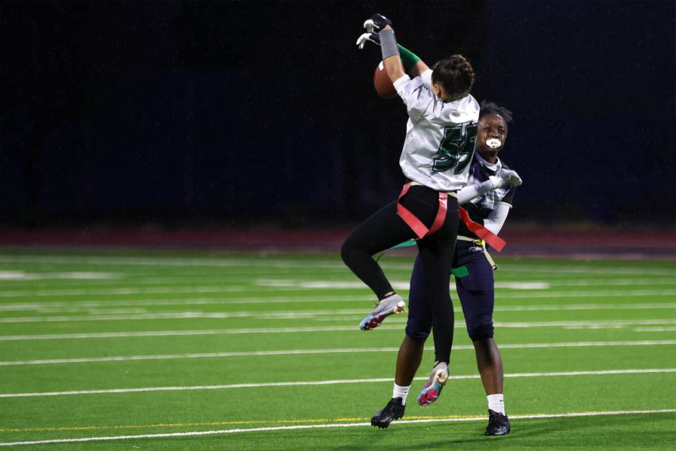 Palo Verde's Arden Petkewich (55) denies Shadow Ridge's Kyliah Rivera-Kyle’s pass during ...