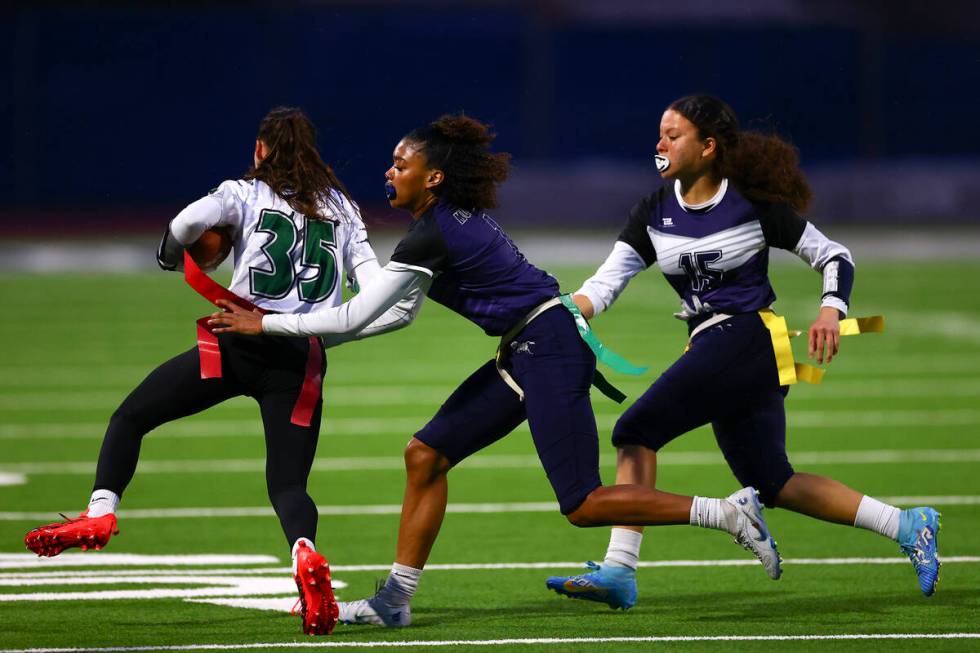 Shadow Ridge's Kyliah Rivera-Kyle (1) takes the flag of Palo Verde's Tia Brown (35) while Shado ...