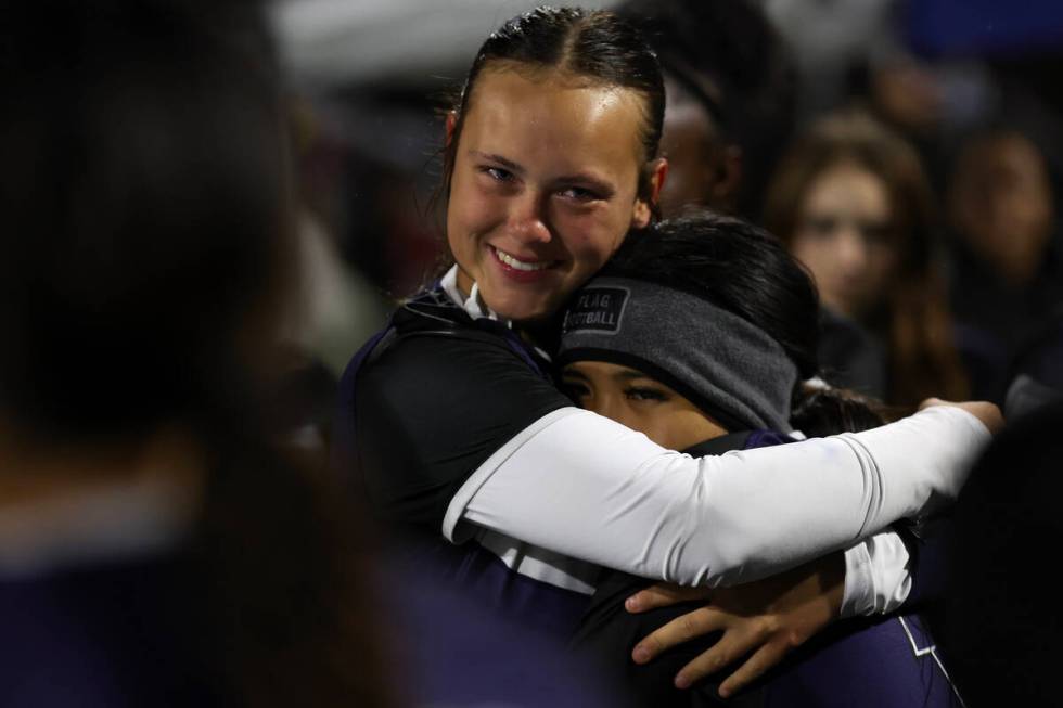 Shadow Ridge's Chloe Covington, center left, embraces a teammate after winning the Class 5A fla ...