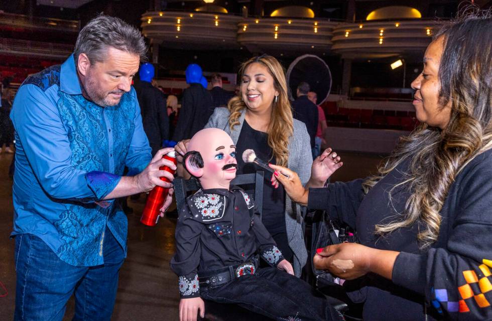 Terry Fator helps to make up his puppet Walter T. Airdale with Rosa Armas and Kiera Bright with ...