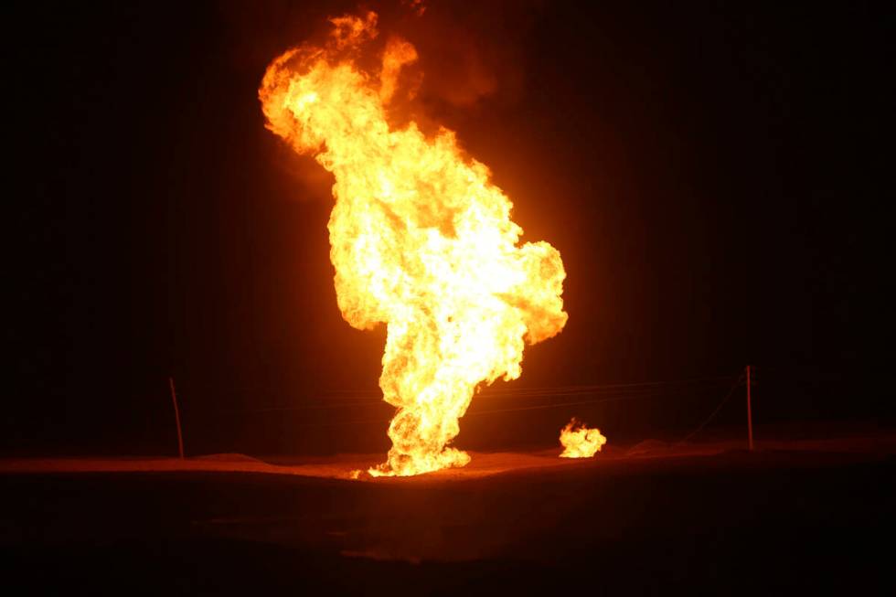 Flames leap into the air after a natural gas pipeline explodes outside the city of Boroujen in ...