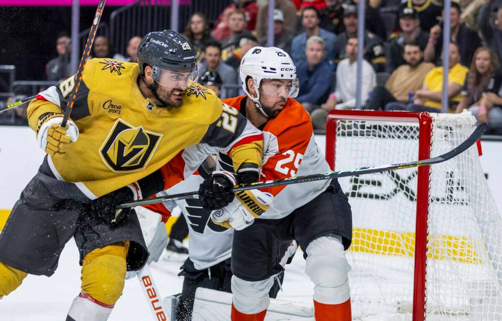 Golden Knights left wing William Carrier (28) battles for position against Philadelphia Flyers ...