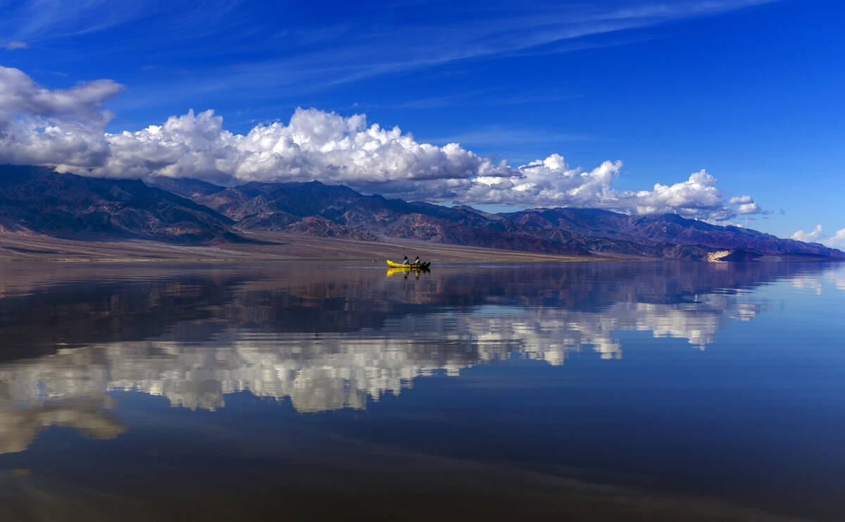 People kayak on the temporary Lake Manly at Badwater Basin in Death Valley National Park on Wed ...
